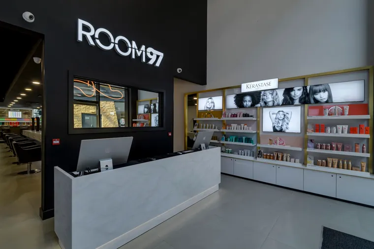 The Room 97 reception with the illuminated ROOM 97 mark