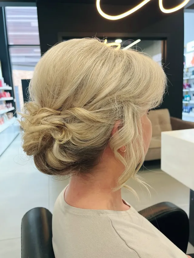 Soft textured blonde bridal updo created at Room 97